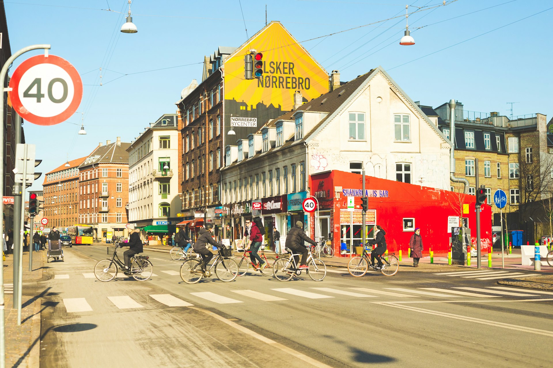Cyclists ride through the hip streets of Norrebro