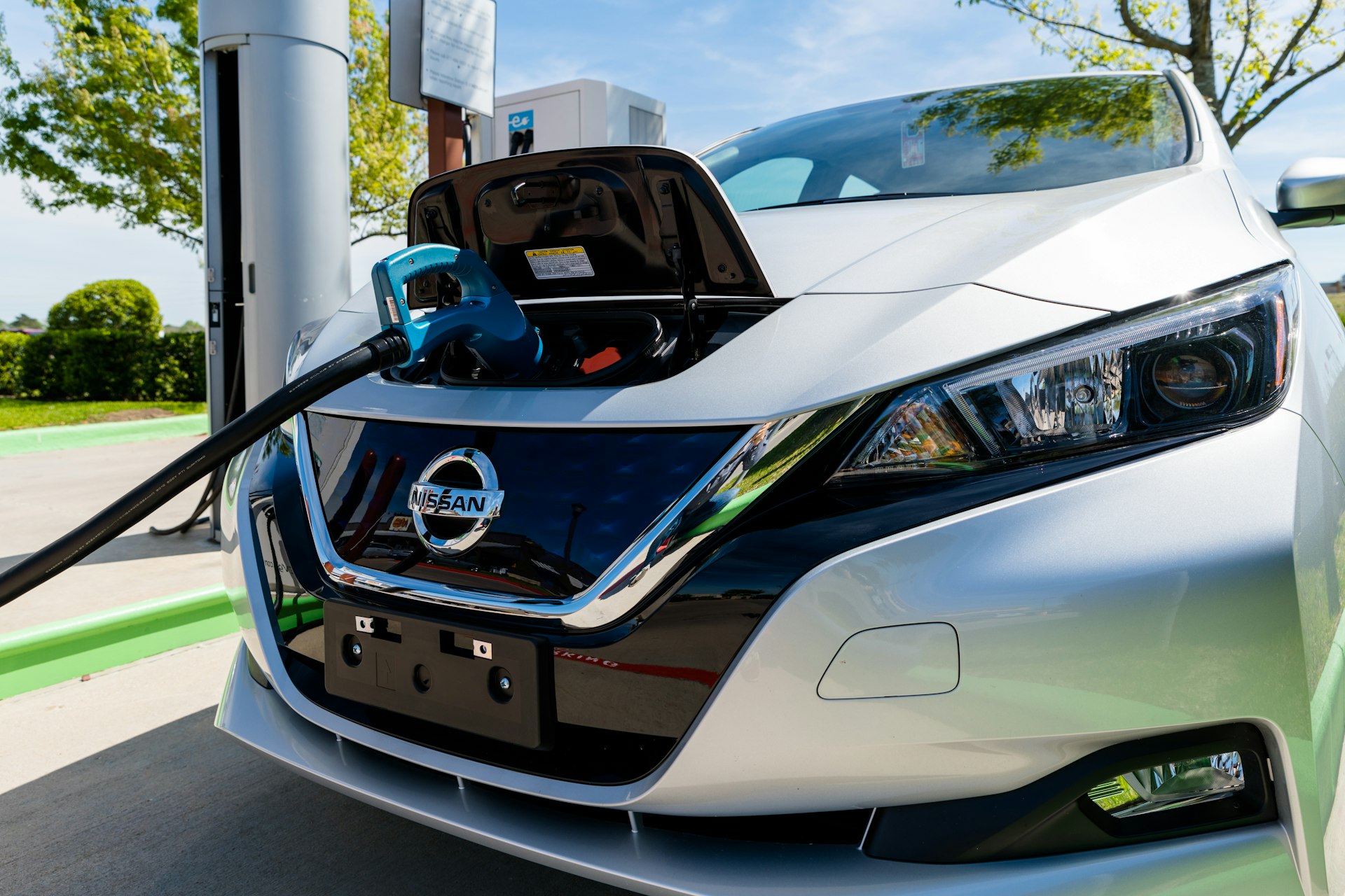 A Nissan Leaf electric car charging at an EVgo charging station