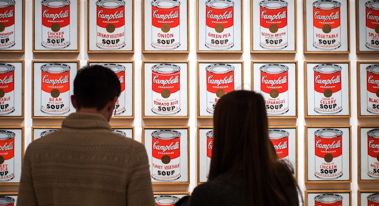 Museum of Modern Art, or MoMA, Manhattan, New York, United States of America - Campbell's Soup Cans, the artwork by Andy Warhol. Leading figure in pop art. Famous work. Visitors watching.
