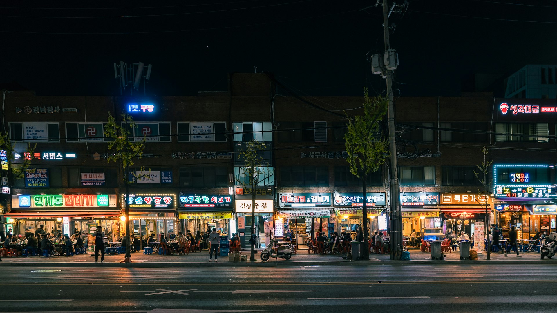 People gather in the evening in Seoul's restaurant district to enjoy alcohol and grilled meat