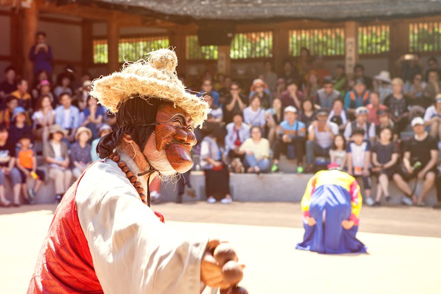 Locals perform a traditional Korean mask dance in Andong's hahoe village