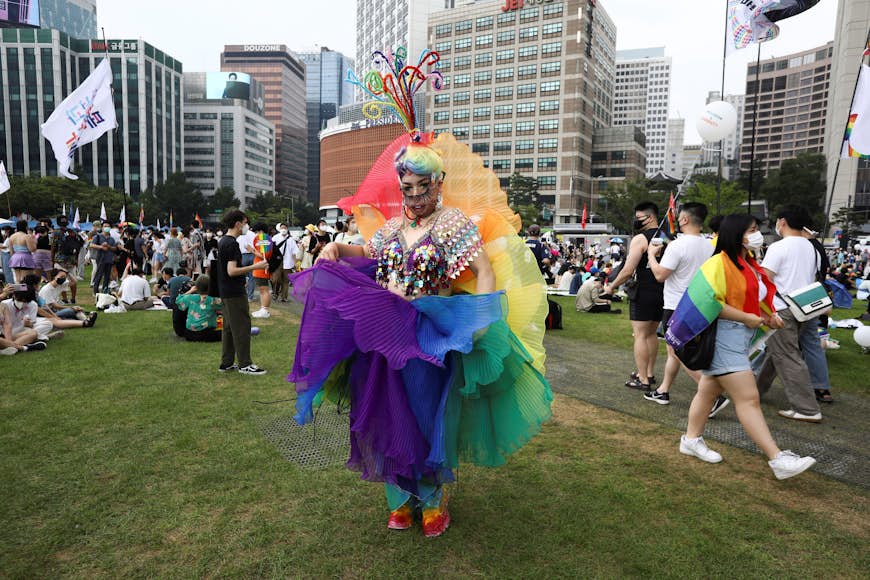 A participant in a rainbow costumer takes part in the Korea Queer Culture Festival 2022 in central Seoul, South Korea