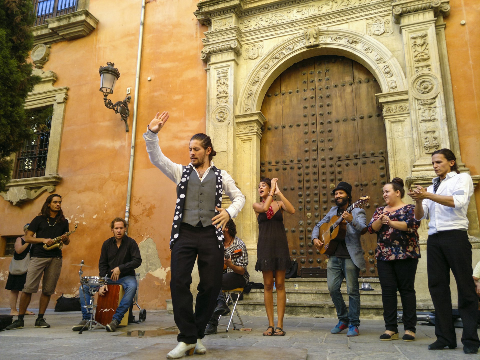 Flamenco dancer and muisicians performing by the Archiepiscopal Palace at Alonso Cano square in the historical centre of Granada