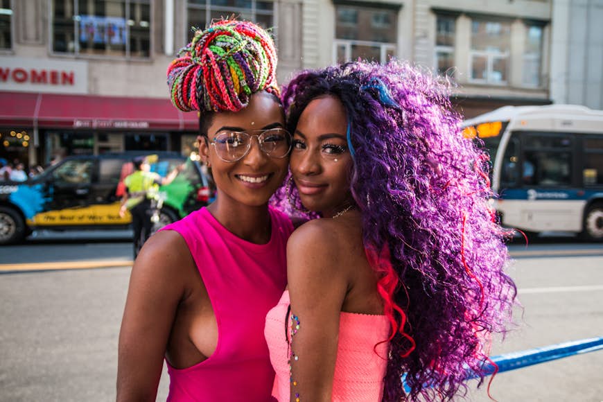Female couple smiling at NYC Pride Parade