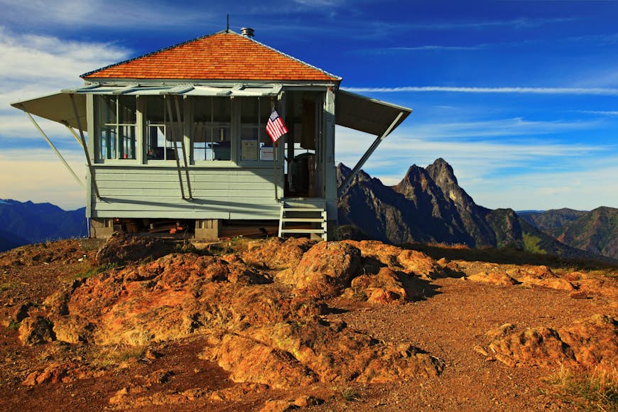 A lookout cabin on a mountain peak in Ross Lake Recreation Area, Washington