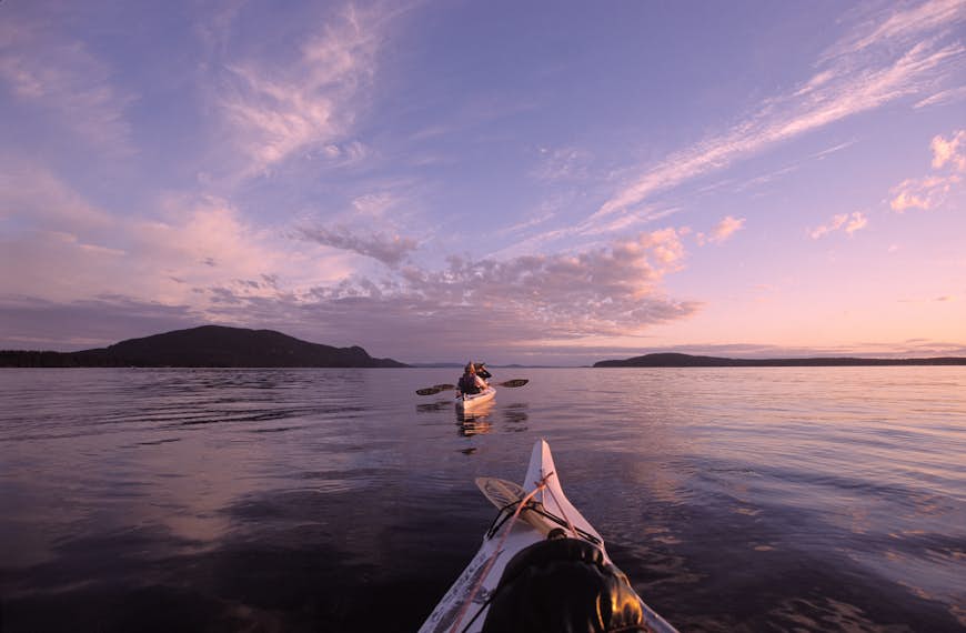Traditional kayaks on the waters of Orcas Island, Washington, at Sunset