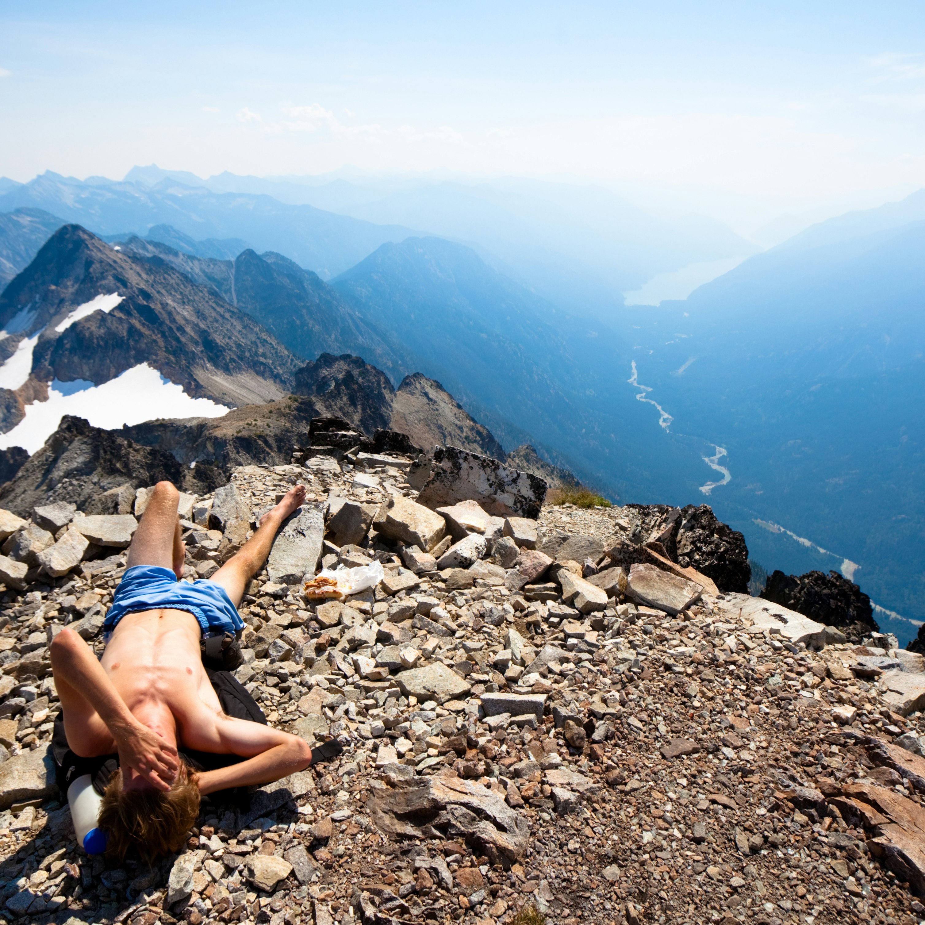 A hiker overlooking a view in the North Cascades National Park of Washington State.For more like this + imagery of young healthy folks adventuring in the out of doors do take a spin through the following:
