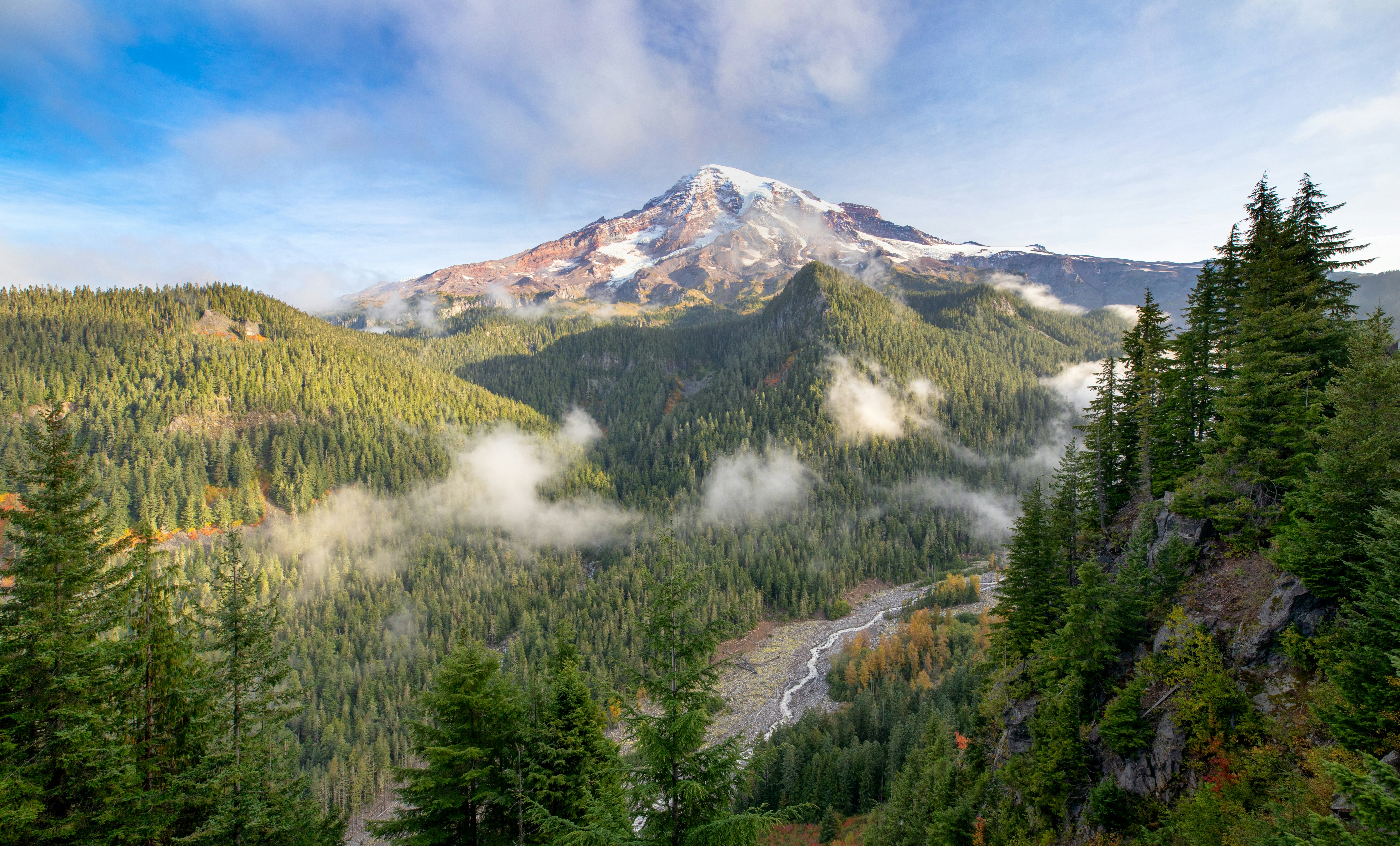 View of Mt. Rainier and the Nisqually River from the Ricksecker Point Scenic Lookout as autumn is beginning to show some colors 