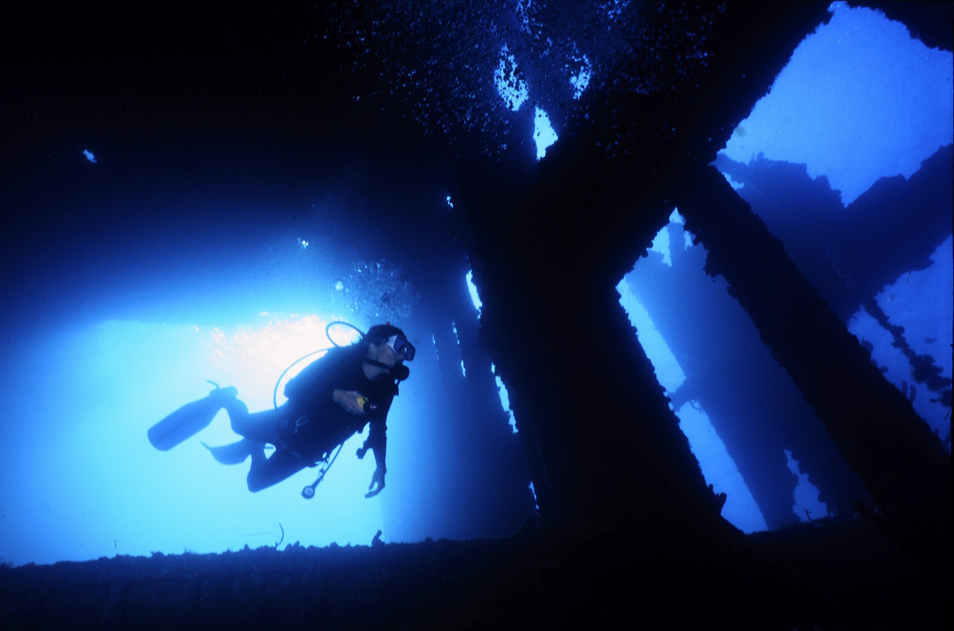 A diver enters the wreck of the SS Antilla in Aruba