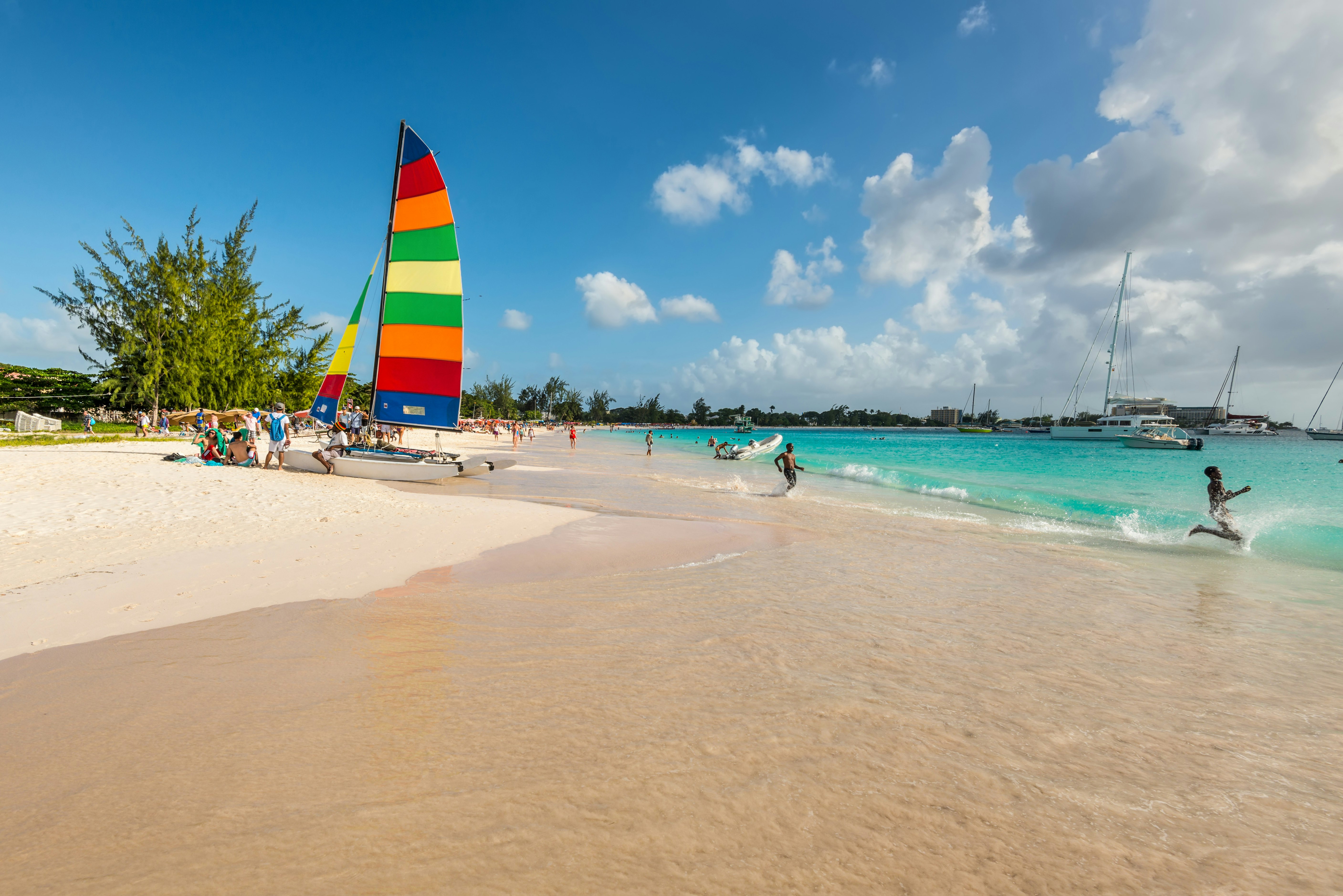 People enjoying the water at Brownes Beach near Bridgetown, Barbados