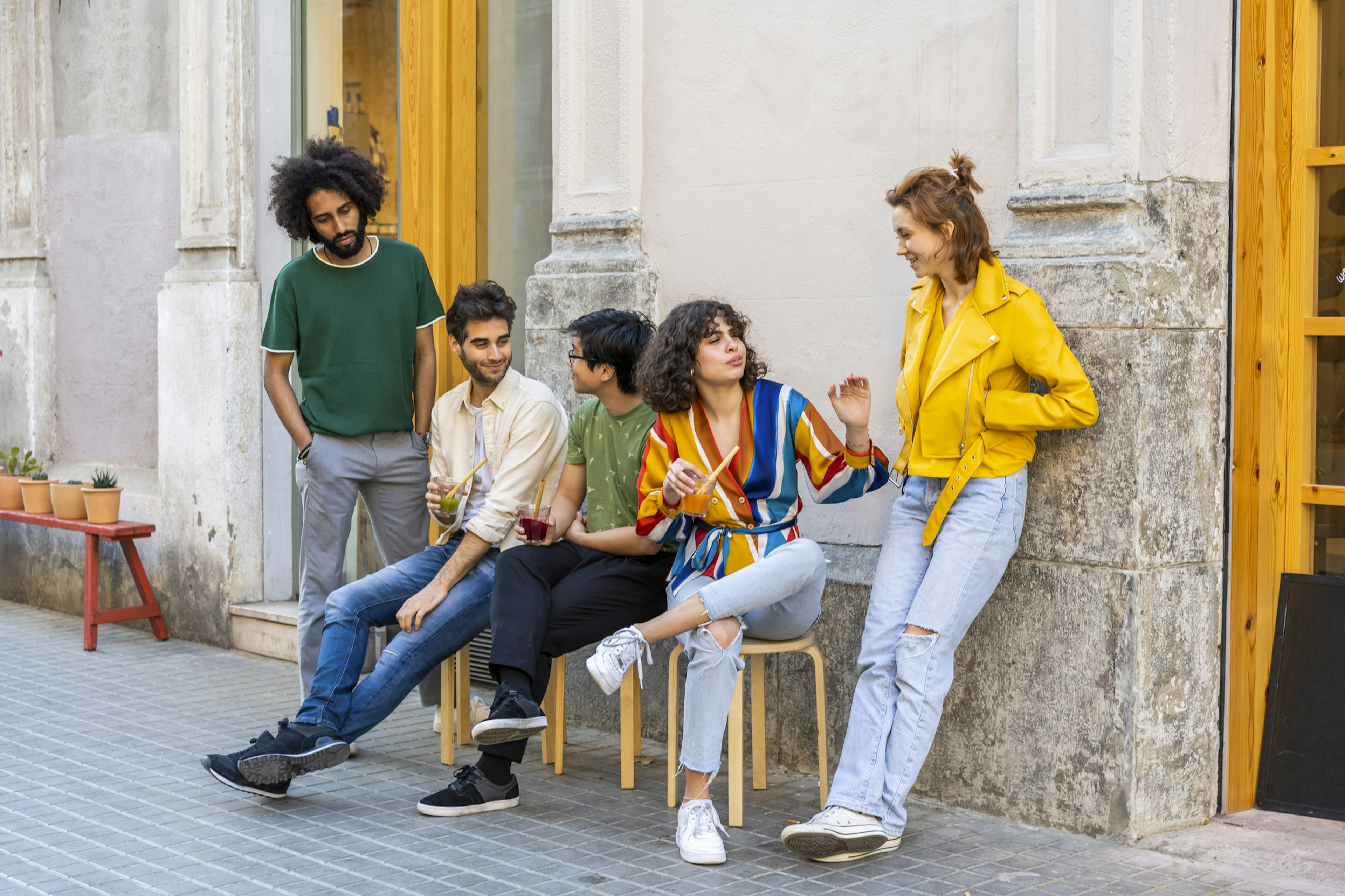 Group of friends having a break in the city