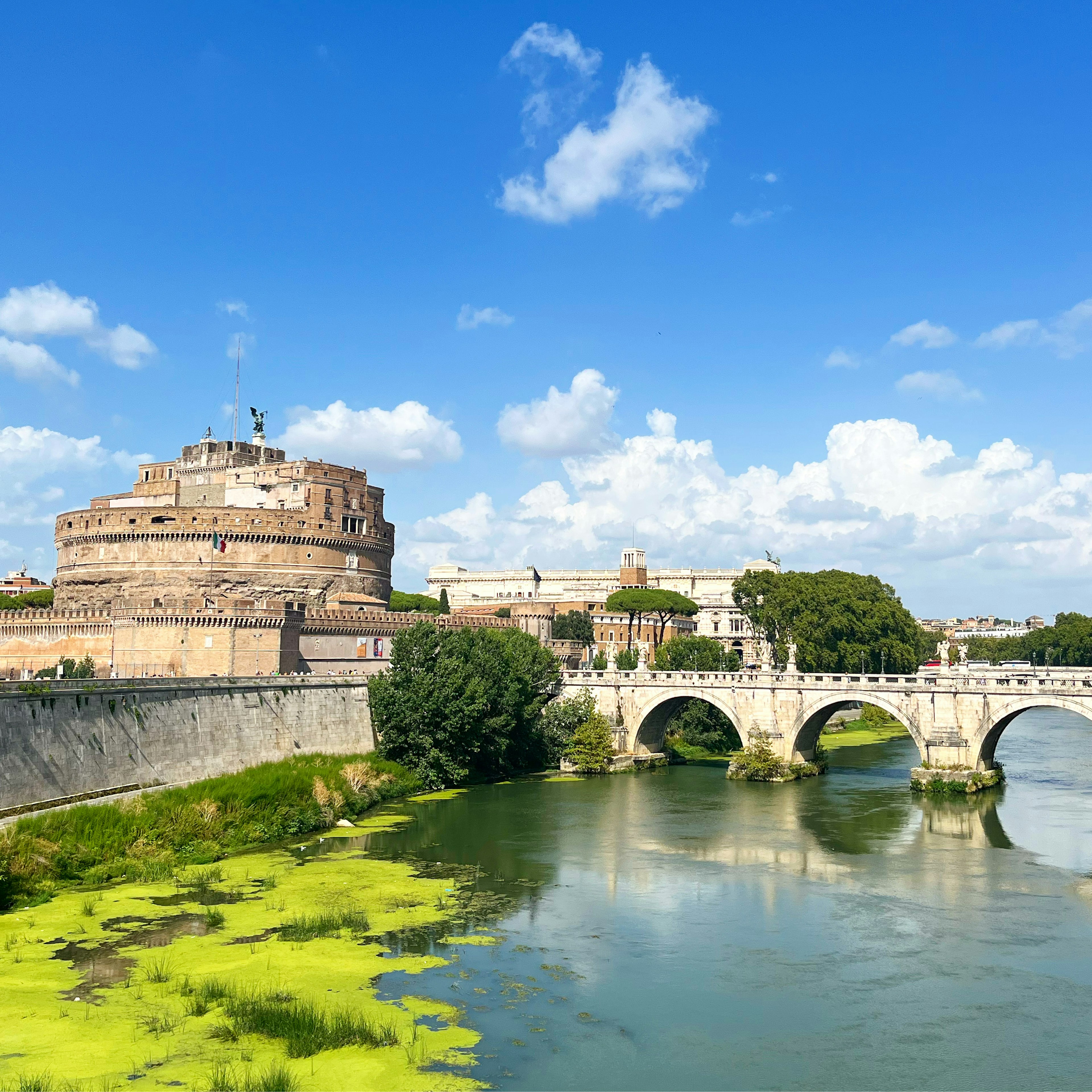 Crossing a bridge in Bianchi Vecchi with Castel Sant'Angelo in the distance