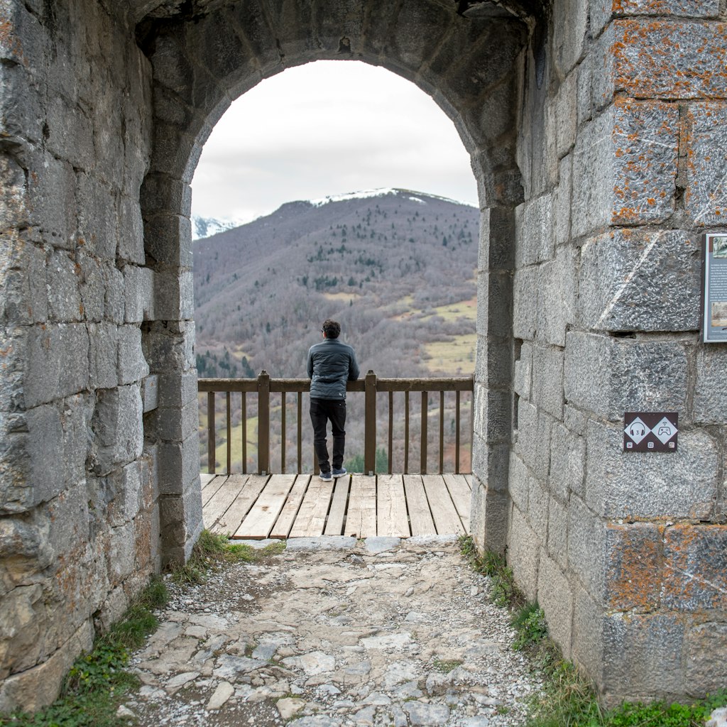 Montsegur, Aringe, France: 2020 from December 20: Men in Cathar castle of Montsegur in Ariege, Occitanie in south of France in winter 2020
