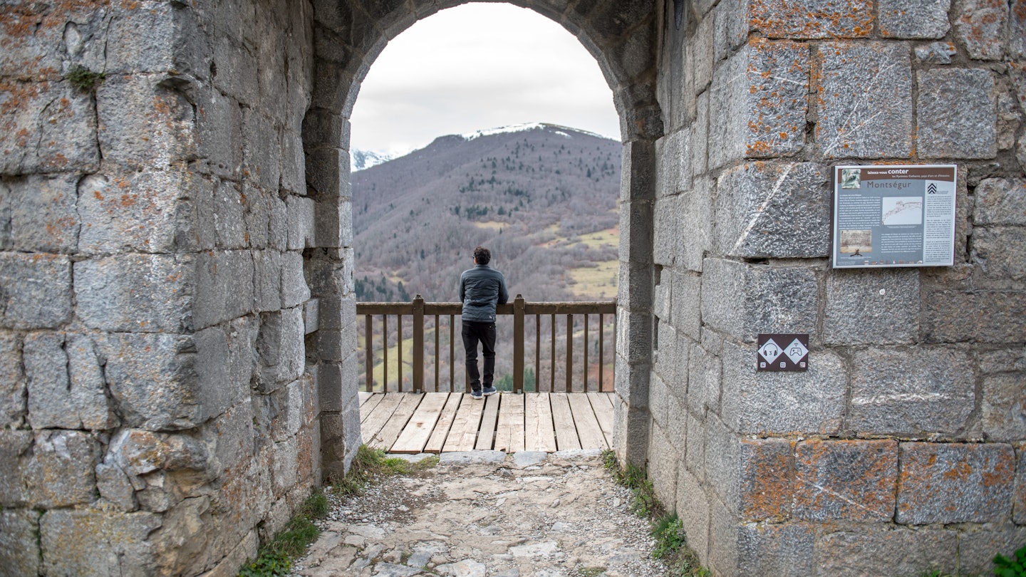 Montsegur, Aringe, France: 2020 from December 20: Men in Cathar castle of Montsegur in Ariege, Occitanie in south of France in winter 2020