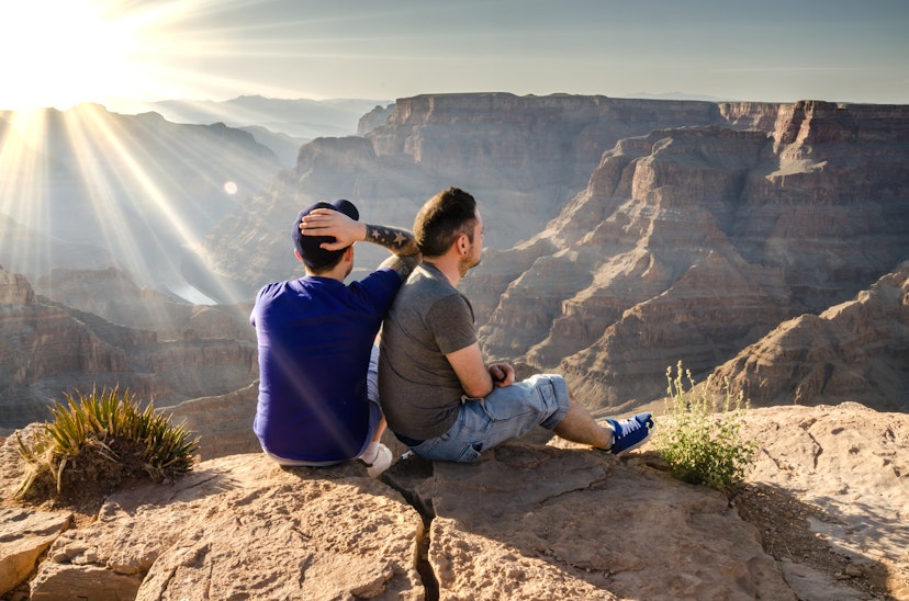 Arizona, USA - January 24, 2014: A young male couple looking into the Grand Canyon in Arizona, USA.