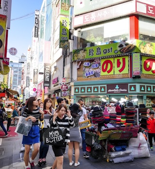 Seoul, Korea - October 3, 2015 : Myeong-Dong shopping street, Korean people tourists walking shopping the neighbourhood. It is fashionable to be the most popular. neighbourhood is must when traveling.