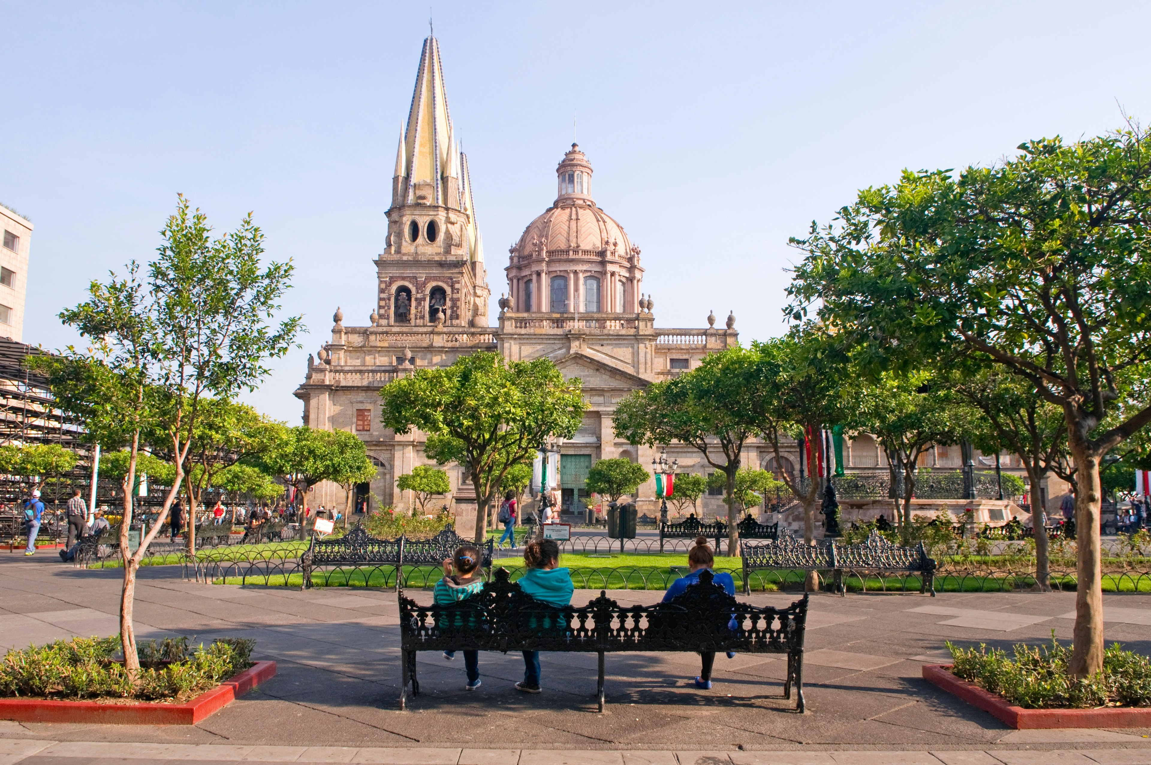 FB6G1K People relaxing in the square (plaza) near the Metropolitana Caatedral (cathedral) in Guadalajara, Mexico