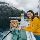 Young Caucasian woman traveling by ferry in Norway