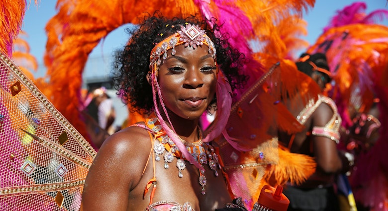 A dancer performs during the the Notting Hill Carnival in west London. (Photo by Hollie Adams/PA Images via Getty Images)