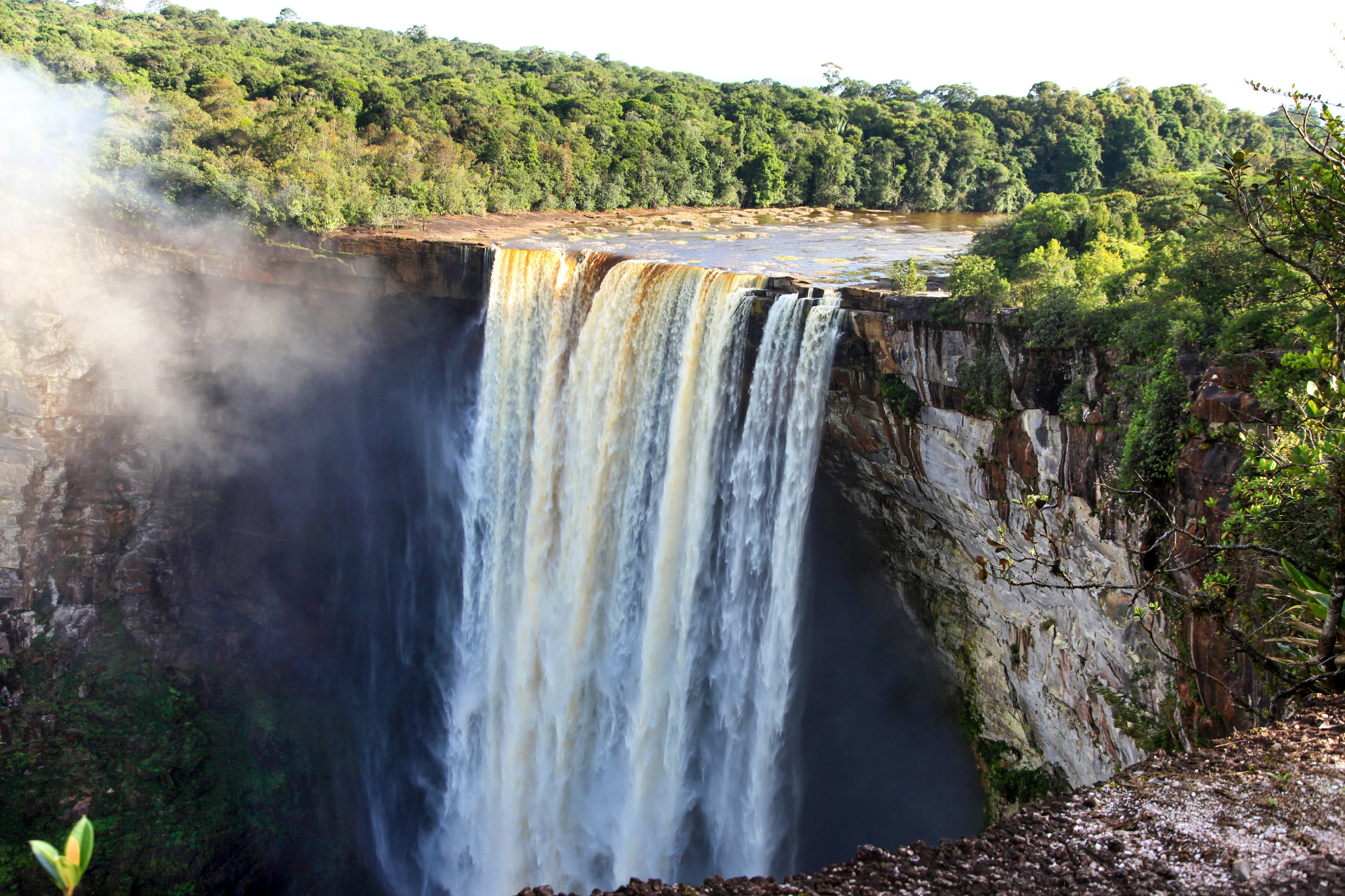 View of The beautiful powerful Kaieteur waterfall on a clear Sunny day against the background of the jungle, the height of the waterfall is 221 meters