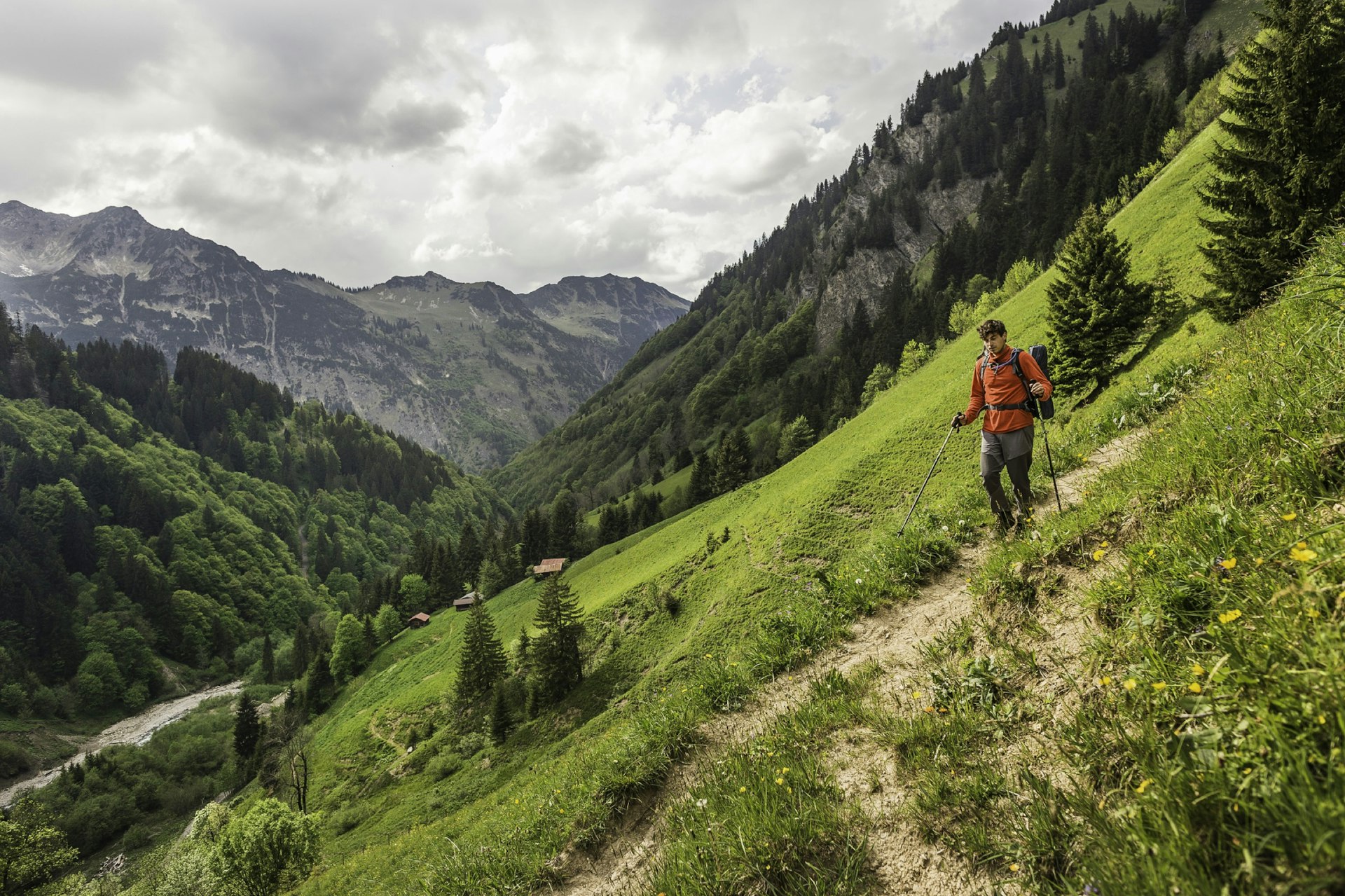 Young man hiking on valley path, Oberstdorf, Bavaria, Germany