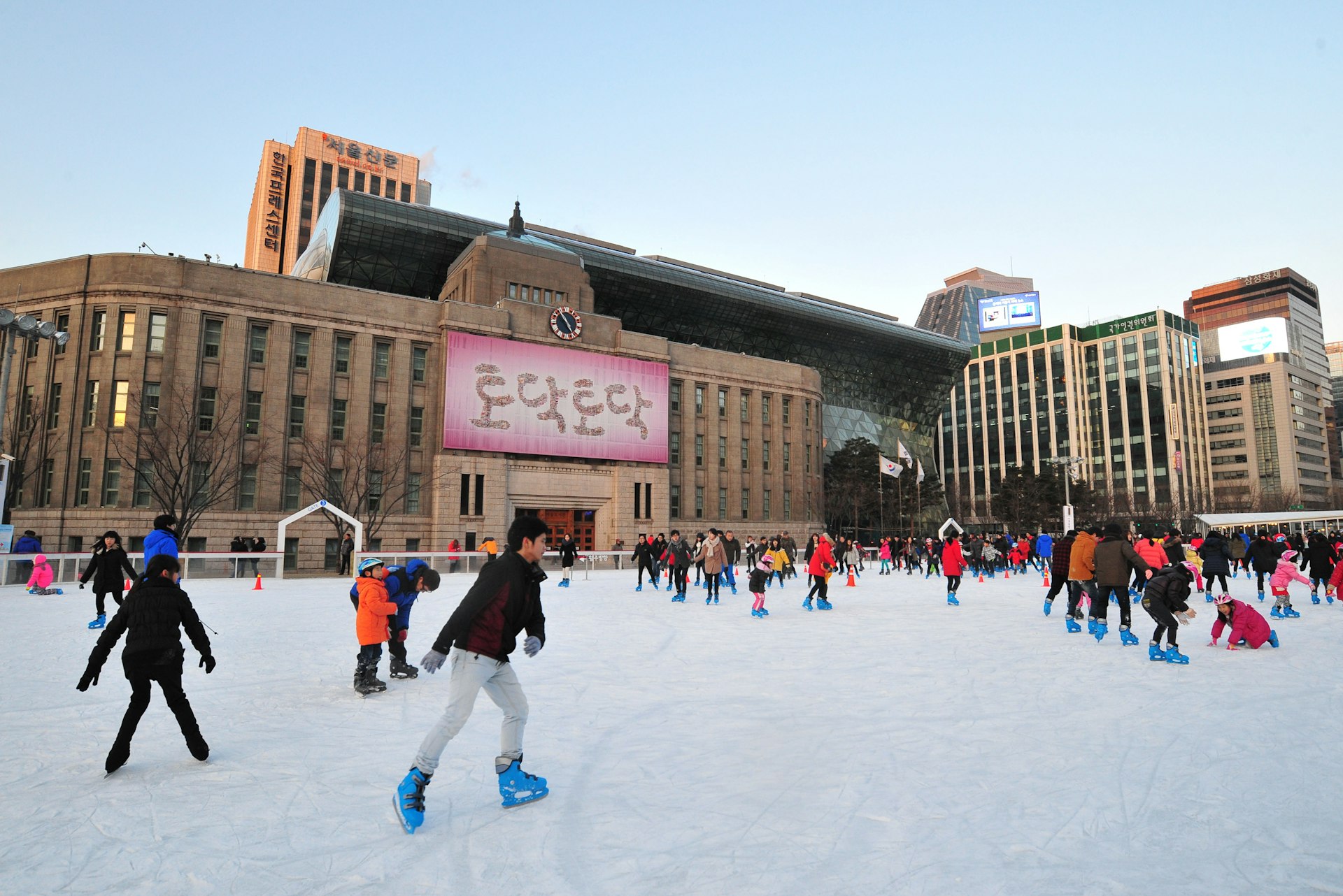Koreans ice-skating at Seoul Square in front of Seoul City Hall, South Korea 