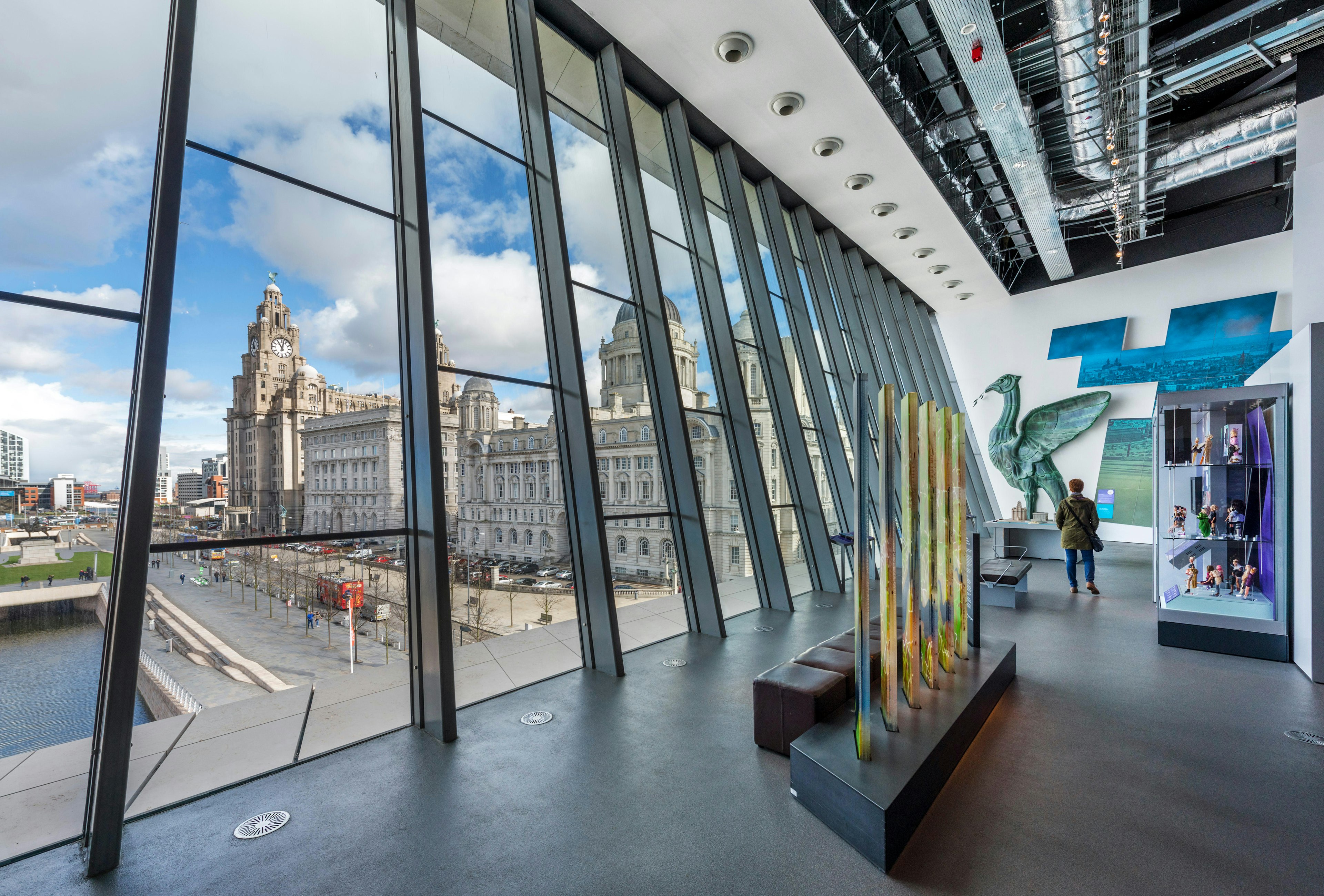 Interior of the Museum of Liverpool looking out over the Three Graces in Liverpool, England