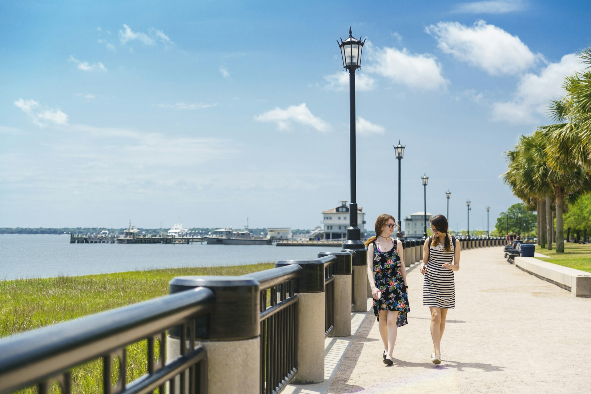 Two teenager girls walks in Waterfront Park, Charleston, South Carolina