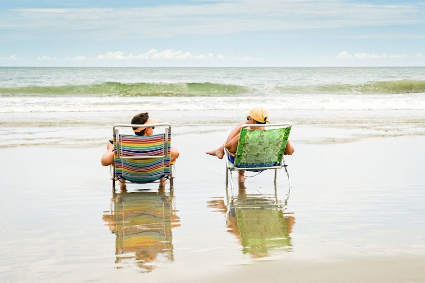 A couple sitting in deck chairs on Myrtle Beach in South Carolina