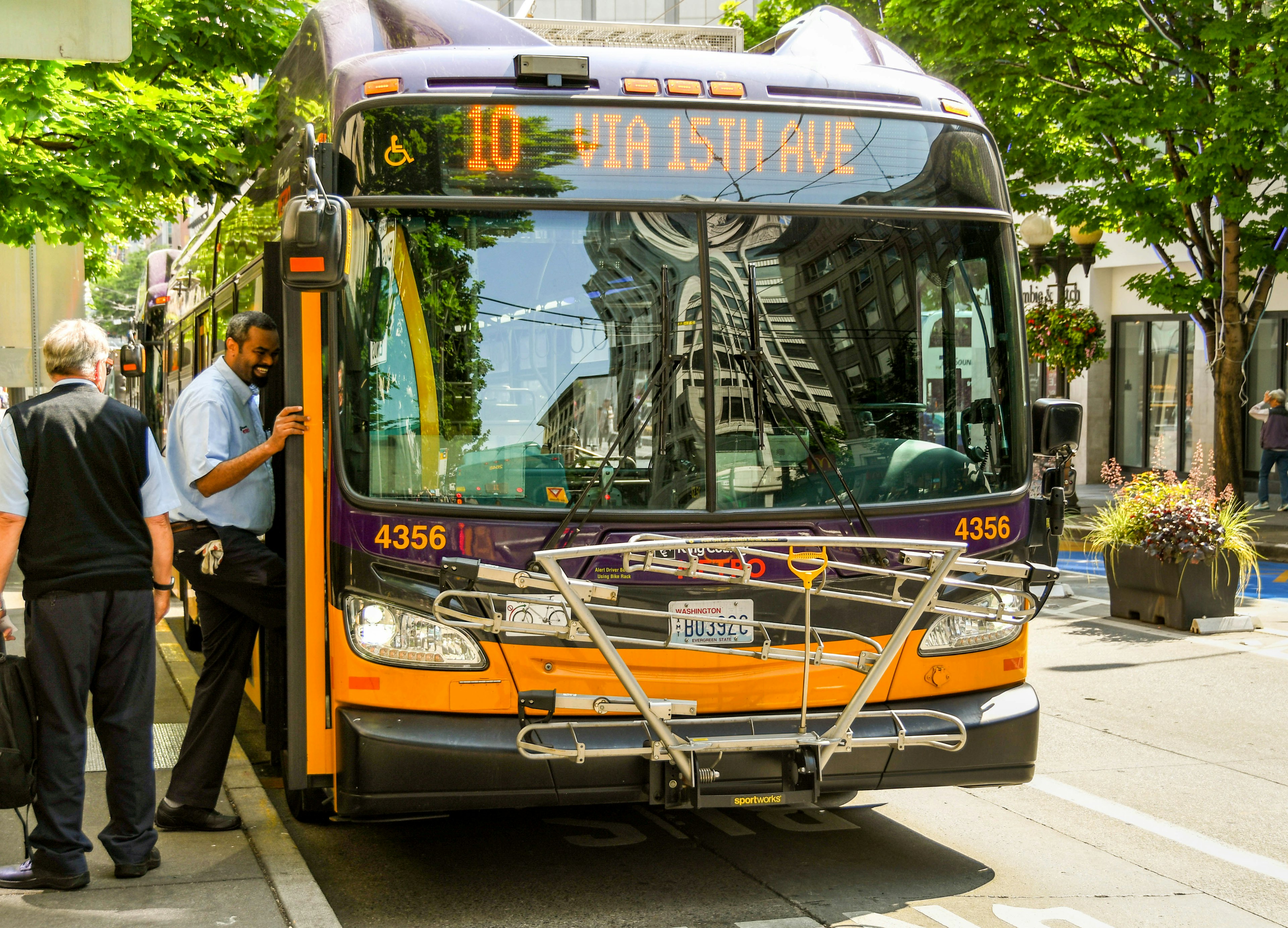 People getting on an electric bus in Seattle