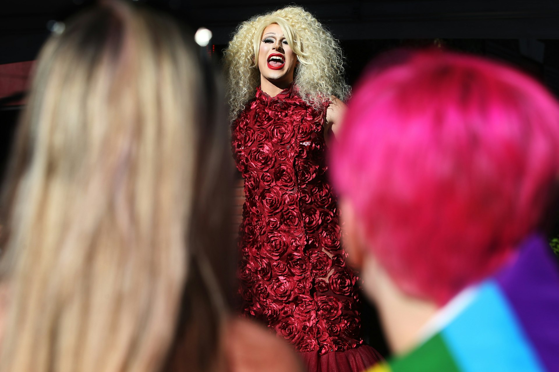 A man in drag performs for a crowd at a drag show during a Seattle PrideFest event in Capitol Hill, Seattle