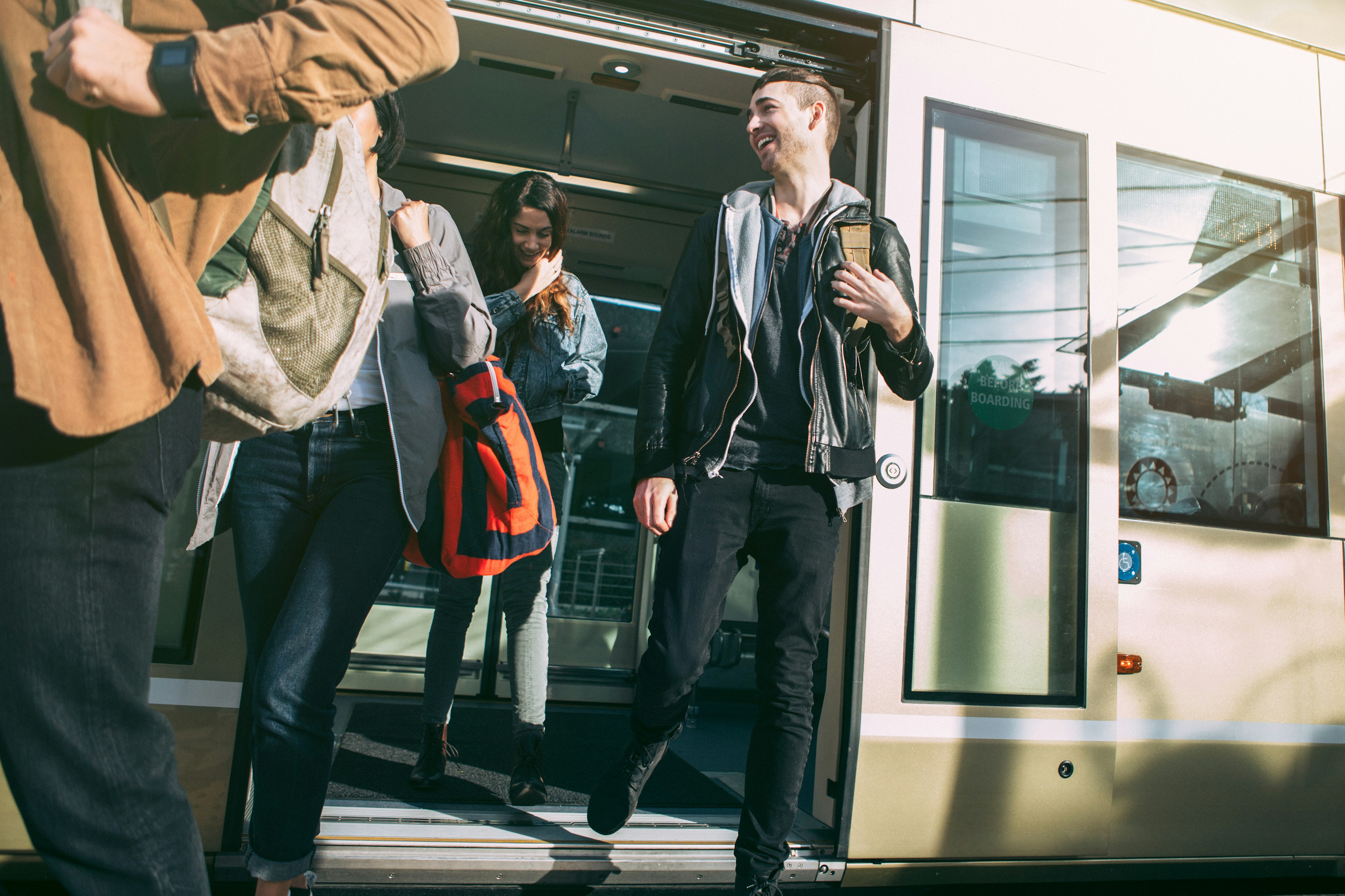 People getting on a light rail train in Seattle