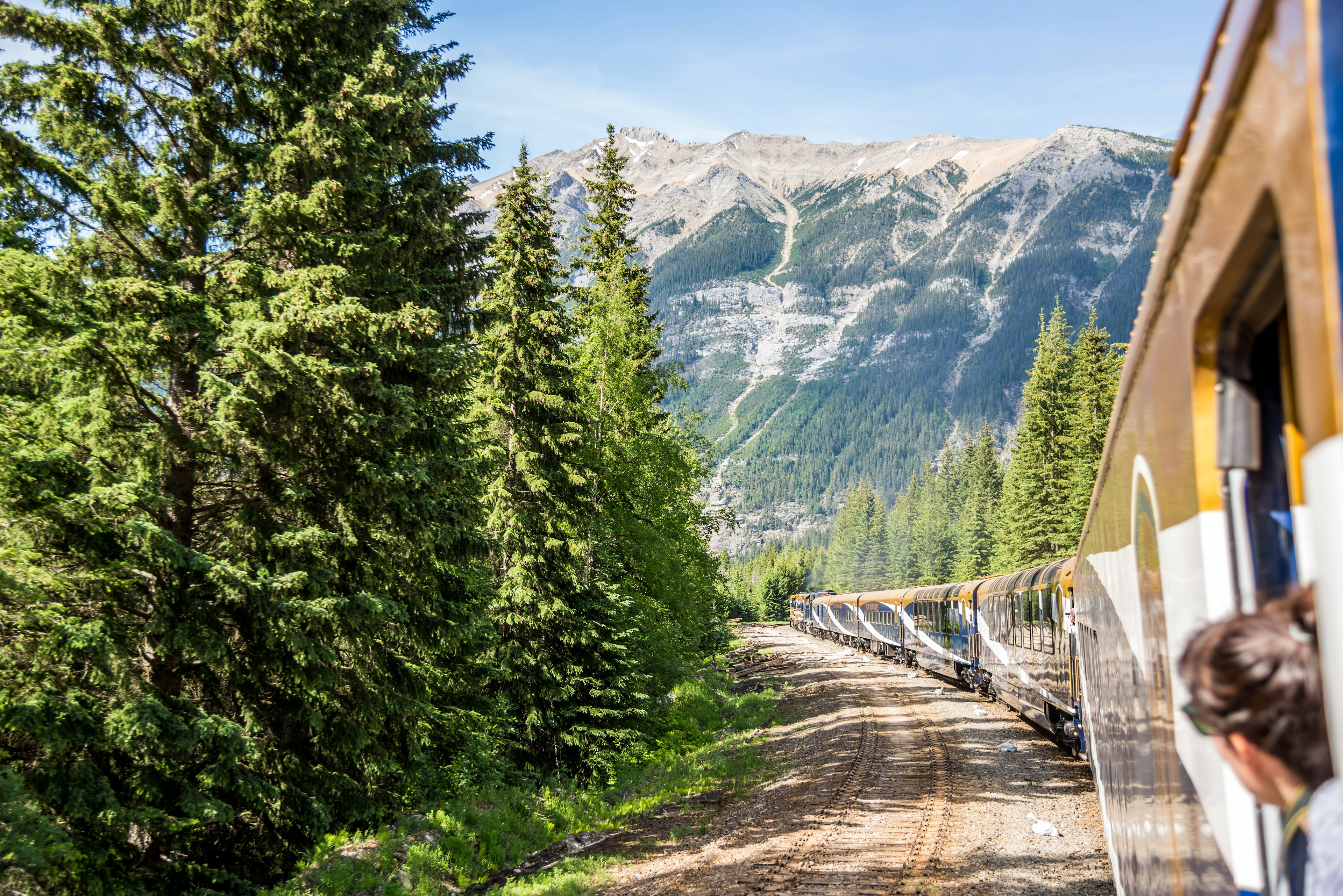 Vancouver, British Columbia / Canada - 06/17/2015 Rocky Mountaineer train traveling through the Rocky Mountains with luxury dining on board.