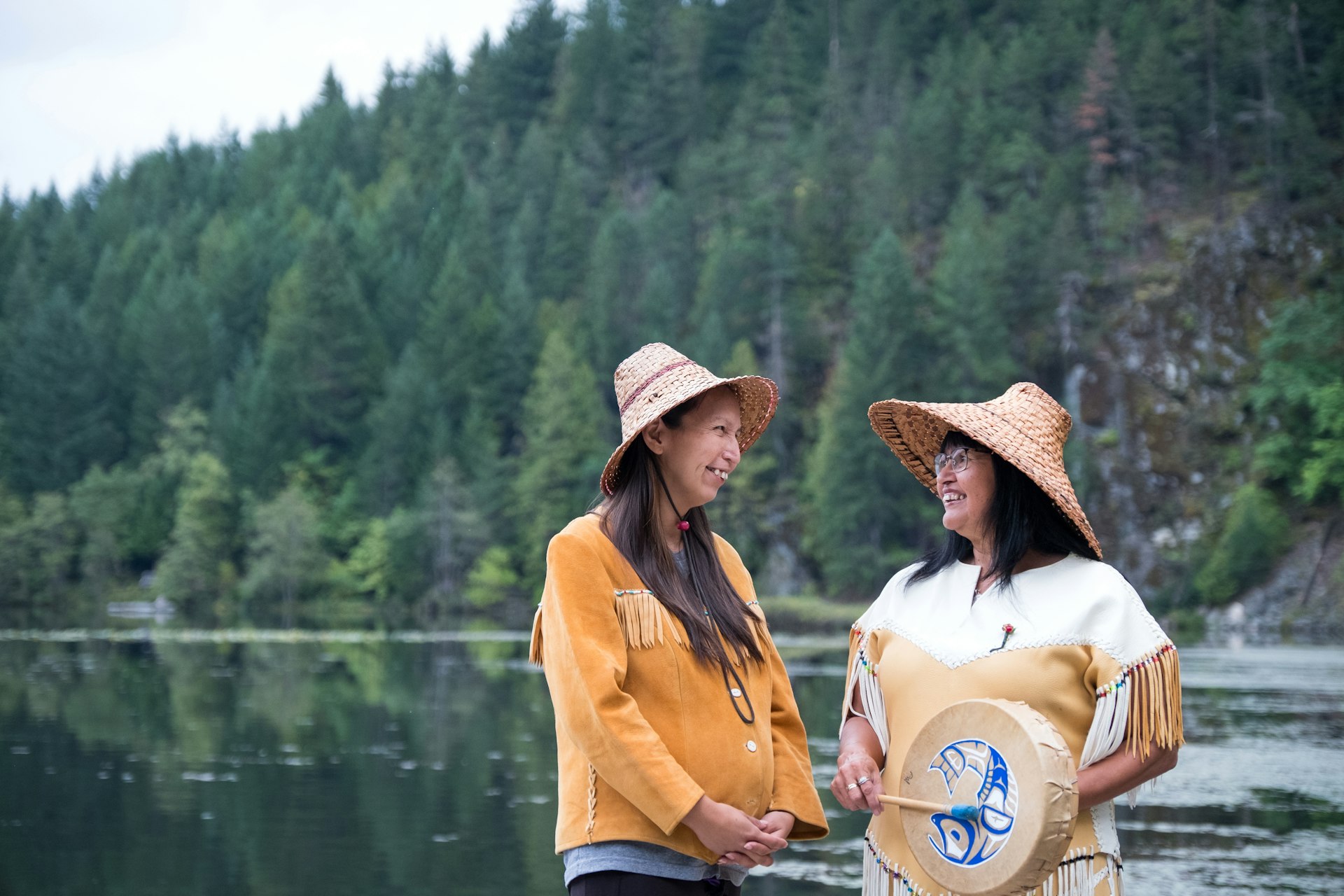 Two female First Nations dressed in traditional clothing.