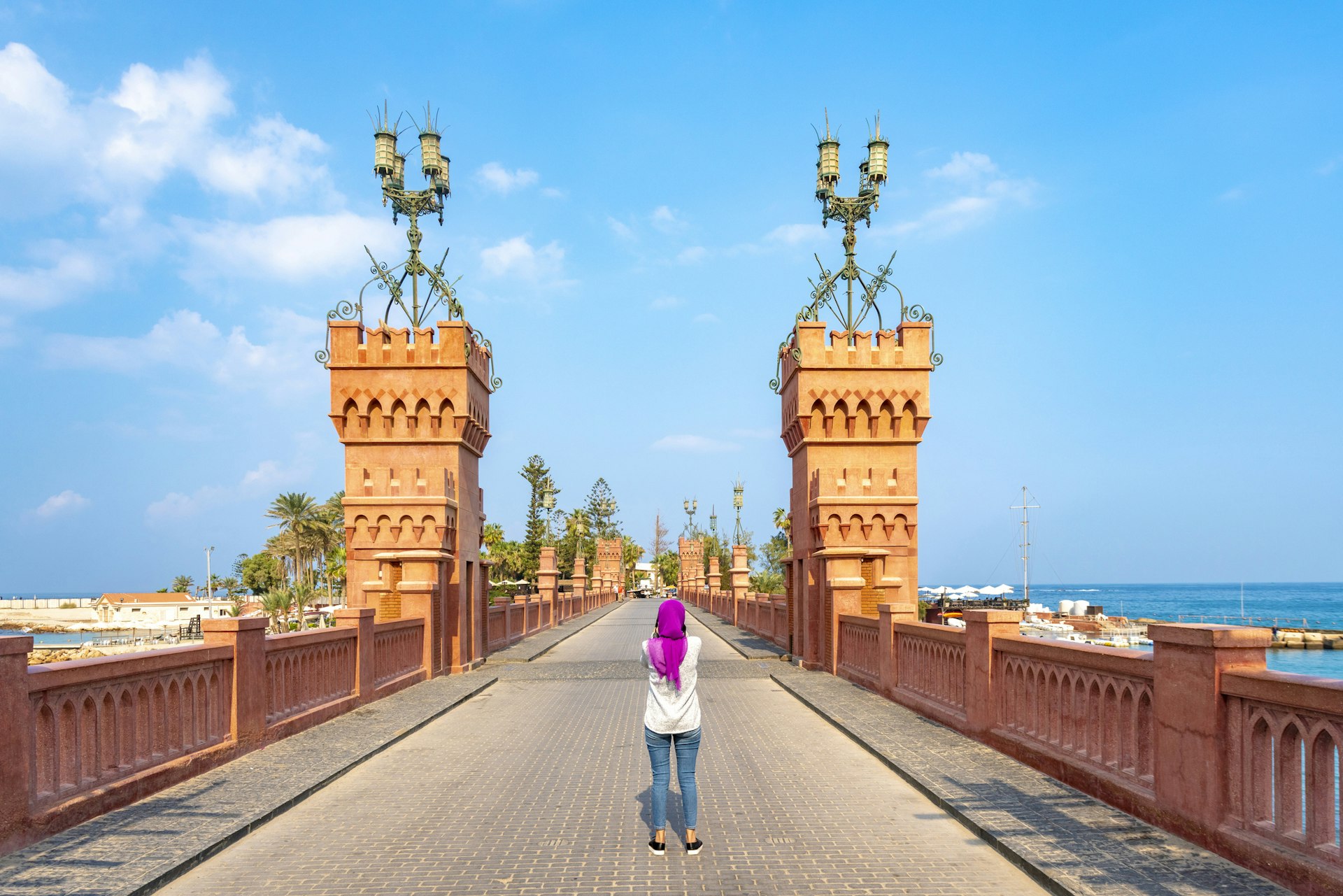 Woman standing on Montaza Bridge in Alexandria, Egypt