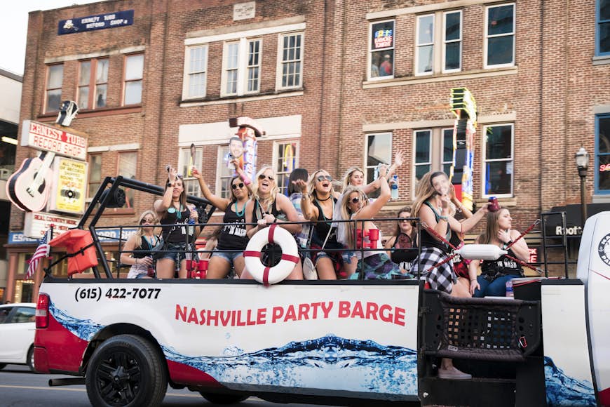 A bachelorette party rides a barge on Broadway in Nashville, Tenn.