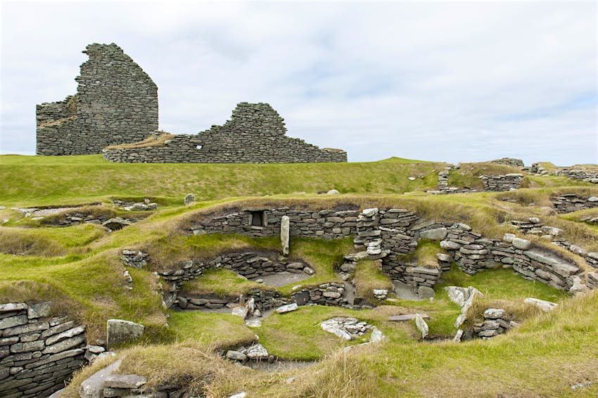 Jarlshof, Scotland Archaeology, prehistoric archaeological site, Bronze Age building in front, half-destroyed broch in back, Jarlshof, Mainland, Shetland Islands, Scotland, United Kingdom