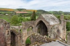Aerial view from ruins of Melrose abbey to blooming Scottish highlands