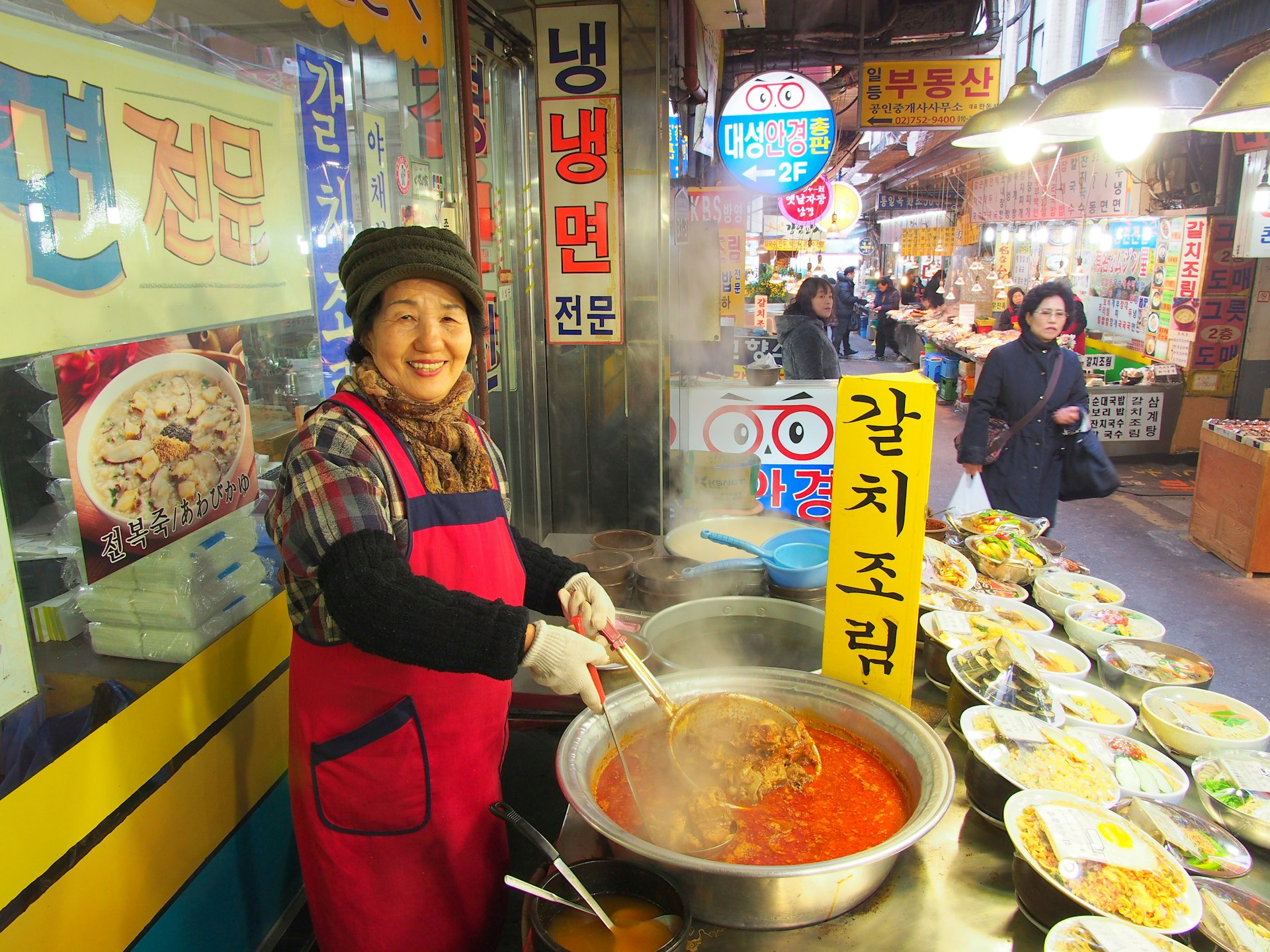 Woman selling soup in winter in Namdaemun Market in Seoul, South Korea