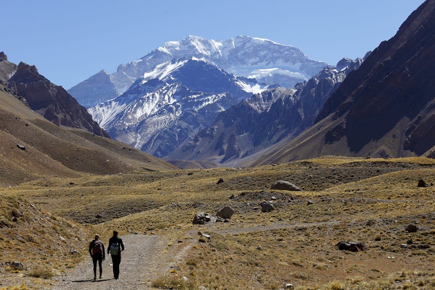 Hikers walking towards Aconcagua, the highest mountain in the Americas, Mendoza, Argentina