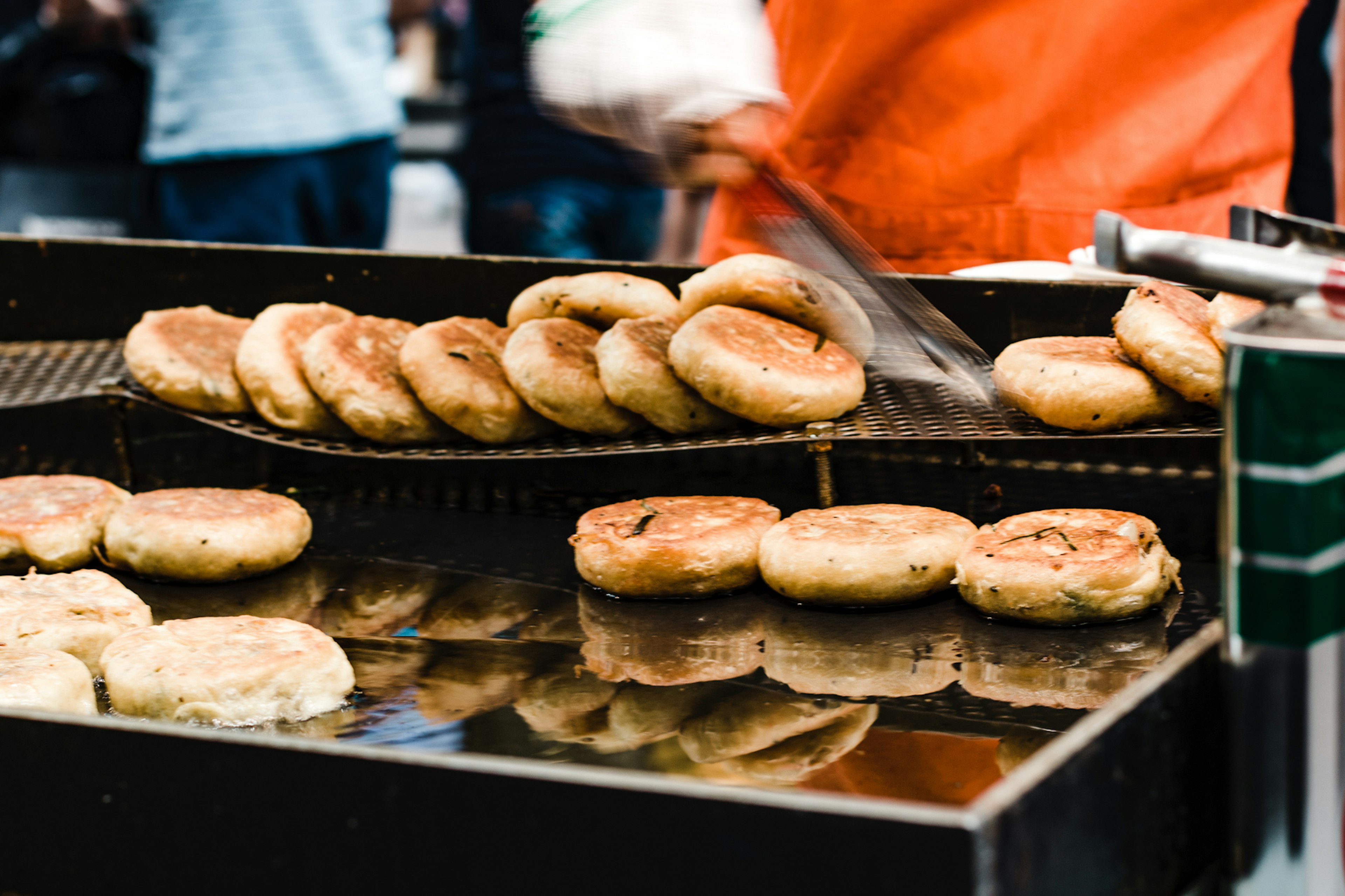 Hot and fried sweet pancakes (or hotteok) sold on the streets in Seoul, Korea