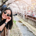 Young woman visiting Jinhae Gunhangje Cherry blossom Festival in South Korea.