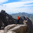Backpacker is enjoying a weekend in nature hiking at Bukhansan National Park near Seoul, Korea.