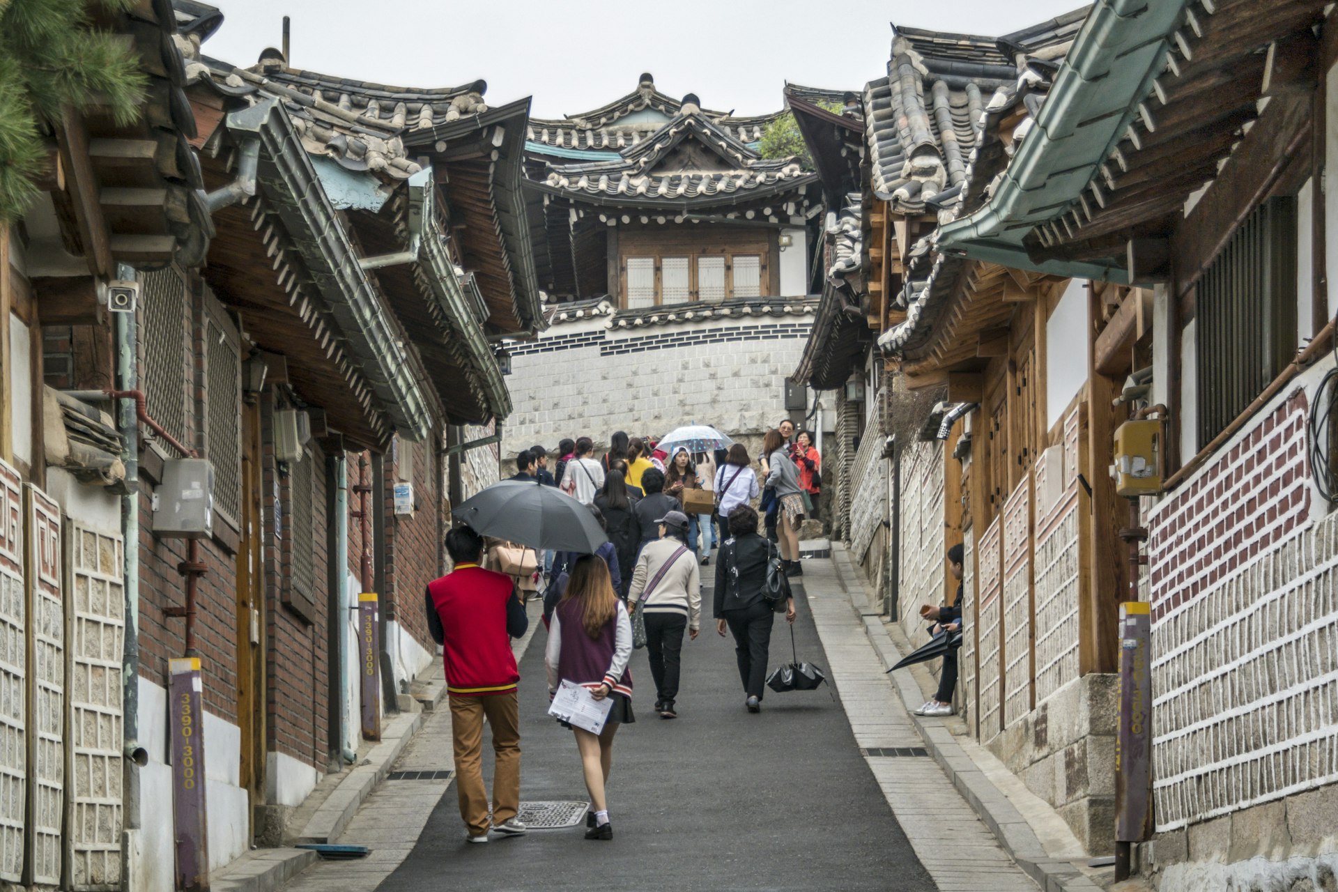 Visitors exploring Bukchon Hanok Village, Seoul