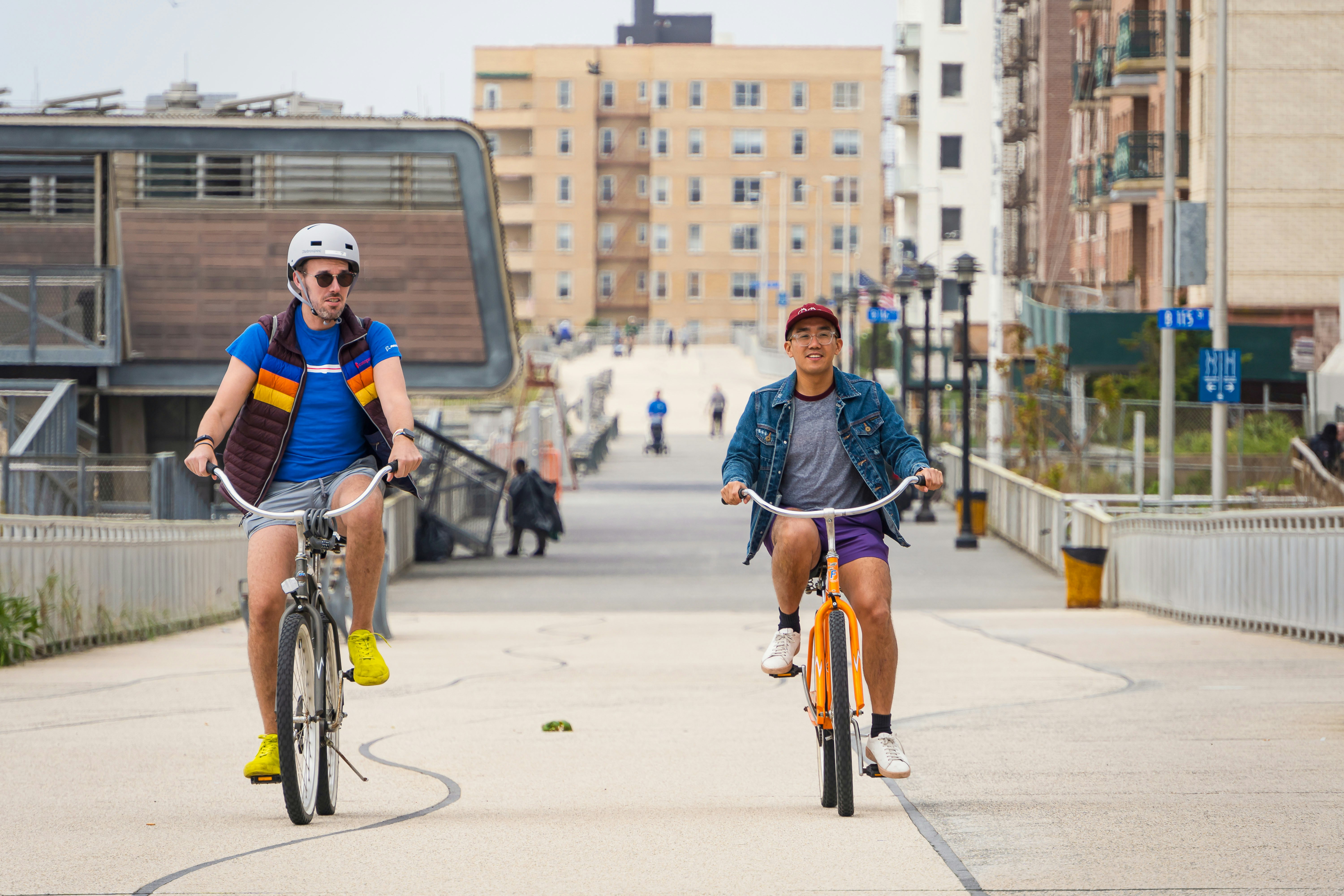 Chris Dong and friend cycle along the boardwalk in Far Rockaway