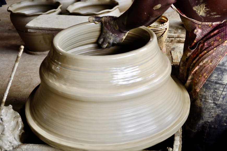 Close-up of man making pottery in Accra