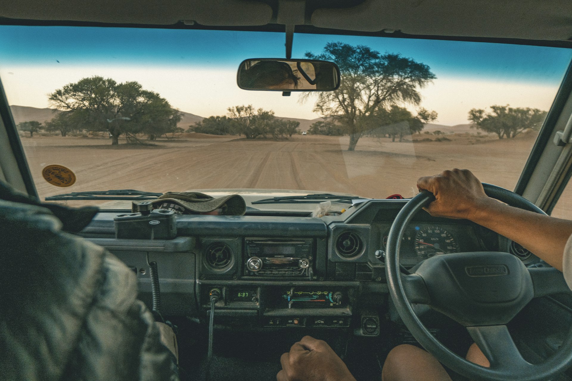 Off-roading in a four-wheel drive going through sand dunes