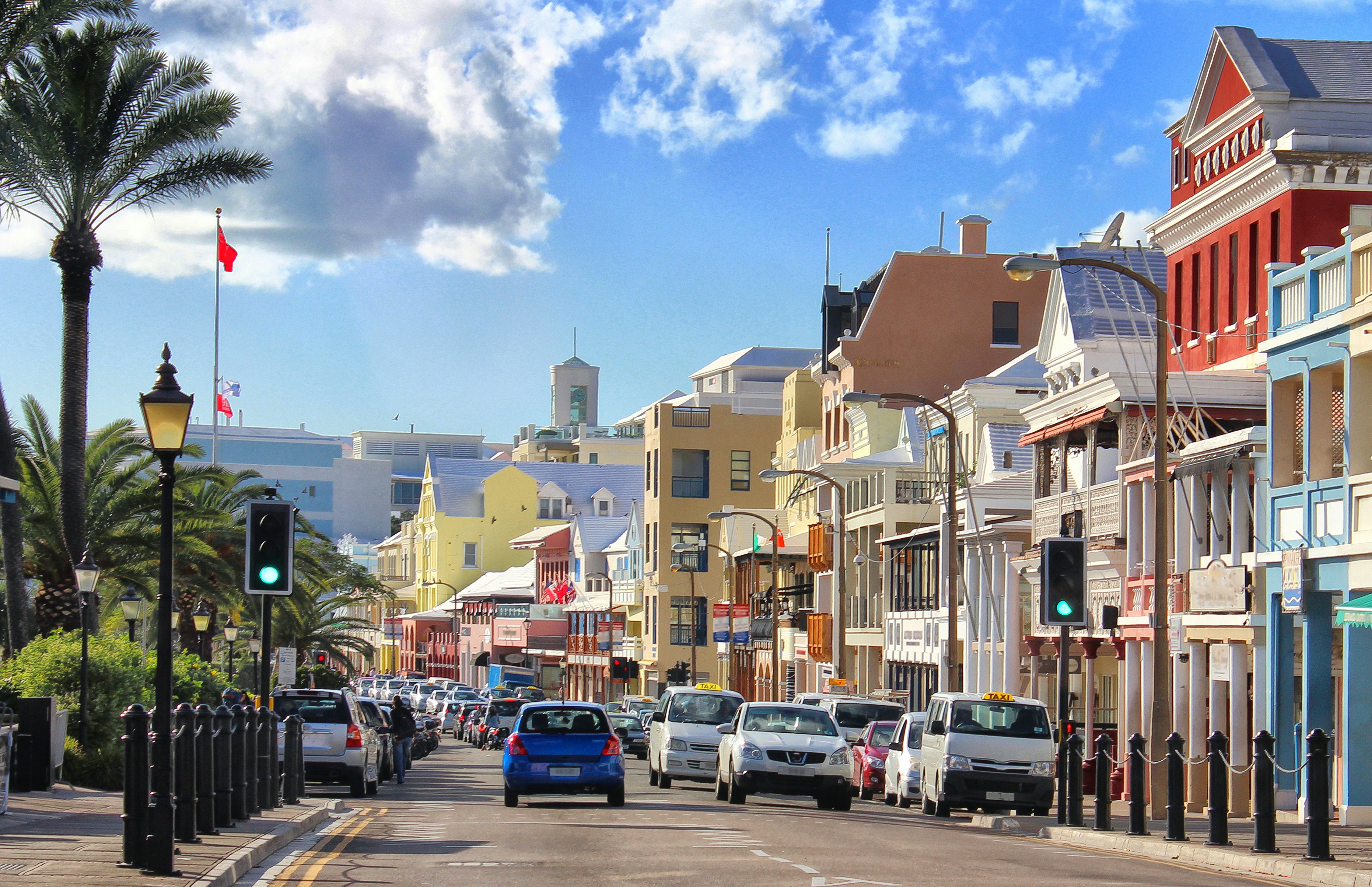 Cars on Front Street in Hamilton, Bermuda, a road lined with pastel-colored buildings