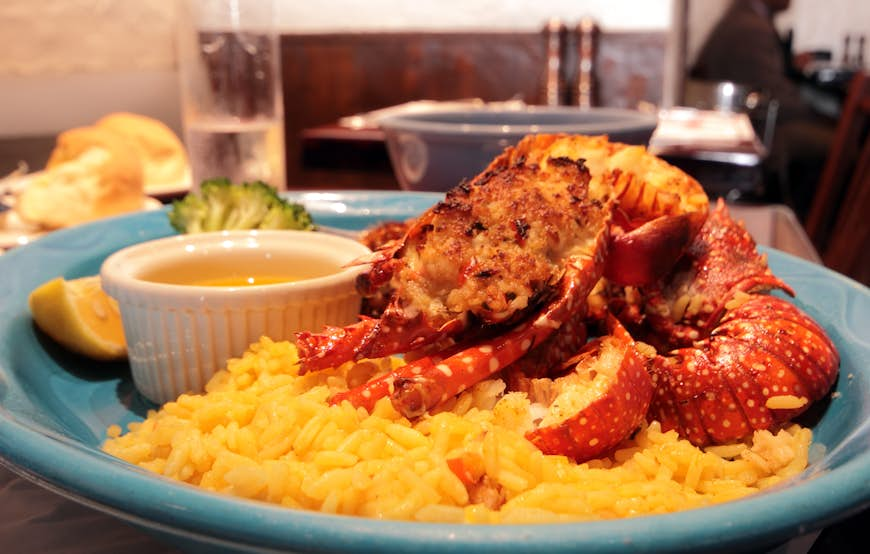 A plate of fresh lobster and rice on a plate in a restaurant in Bermuda