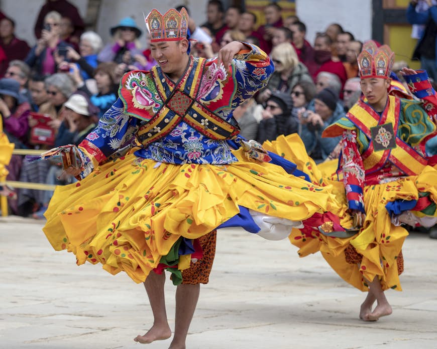 ancers at the Gangtey Monastery in the Phobjikha Valley, Bhutan, performing in the Black-Necked Crane festival, held annually to celebrate the return of the Black-Necked Cranes from their breeding grounds in Tibet 